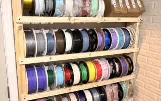 DIY wood filament rack holding 126 spools of 3D printer filament