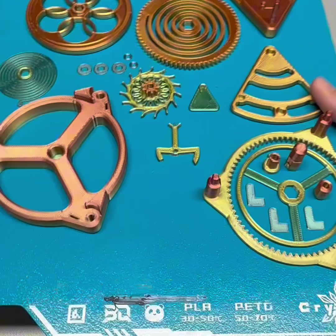 A plate of printed parts & gears